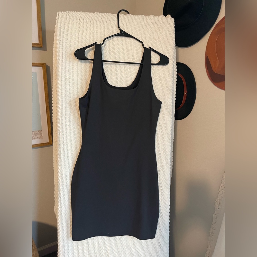 Express Black body contour scoop neck mini dress with built in shape wear.